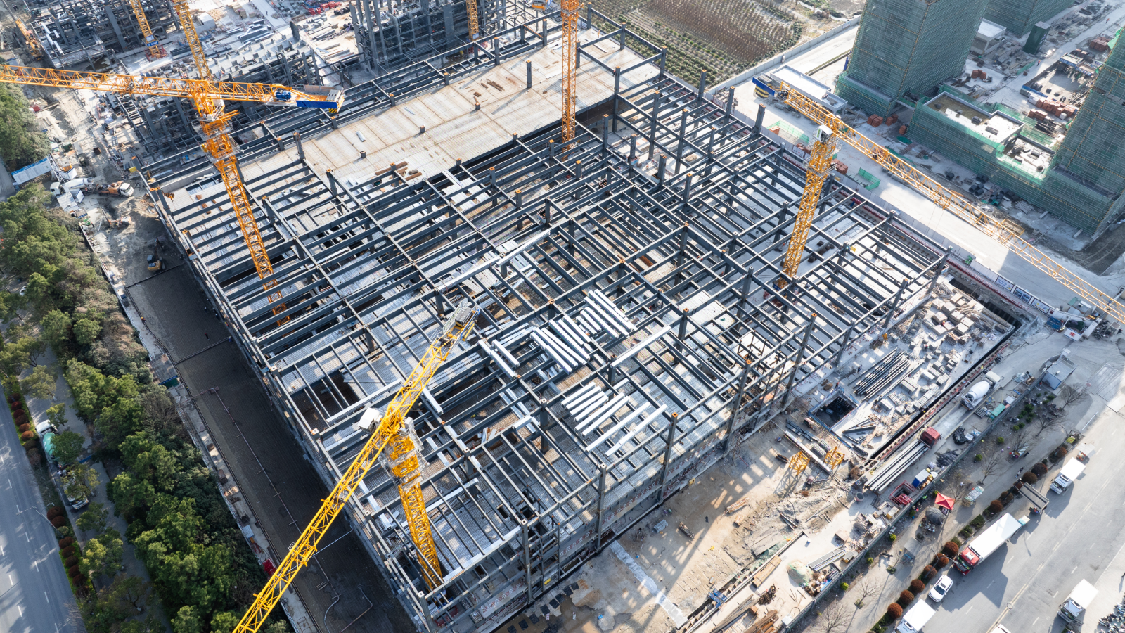 Aerial view of construction site with cranes.