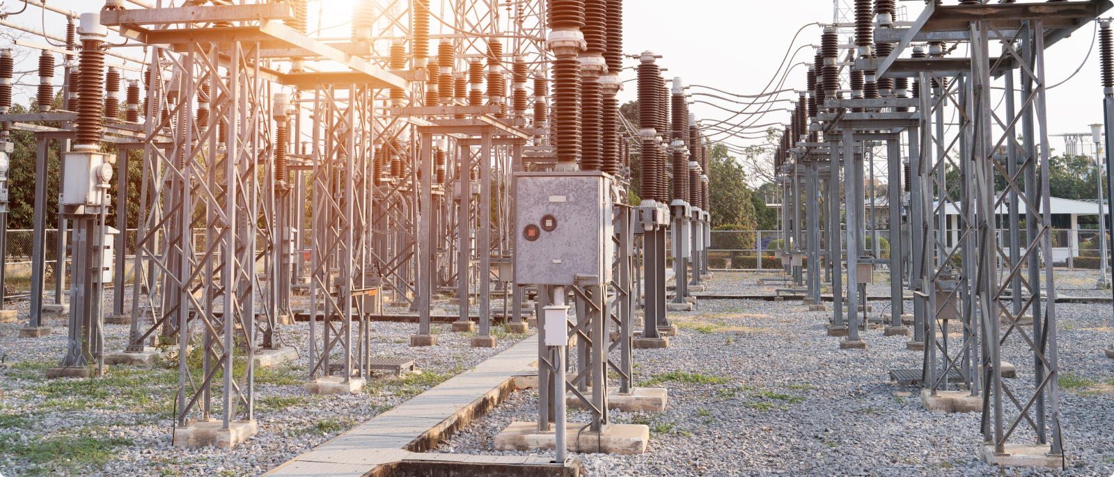 A vast electrical substation with an array of wires and poles, representing the essential components of electrical infrastructure.