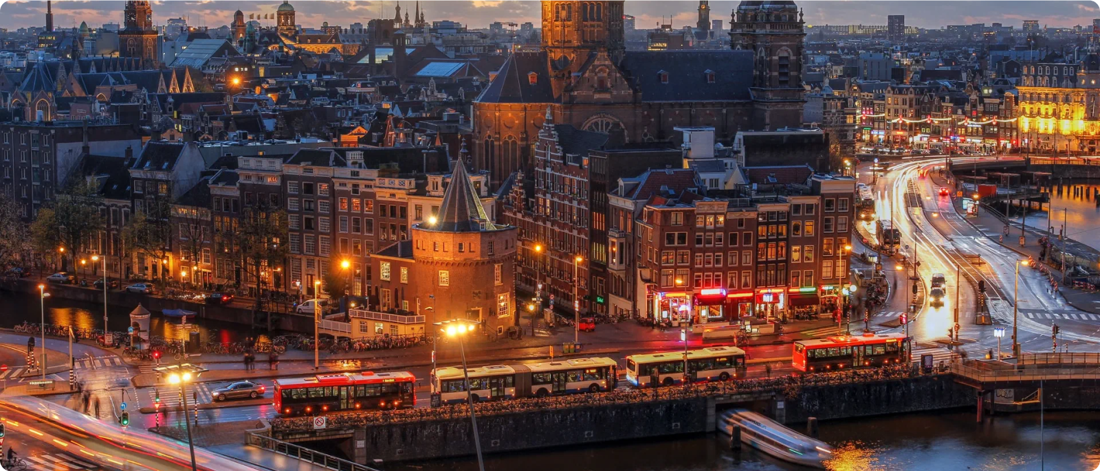 A scenic view of Amsterdam, showcasing its iconic canals and architecture.