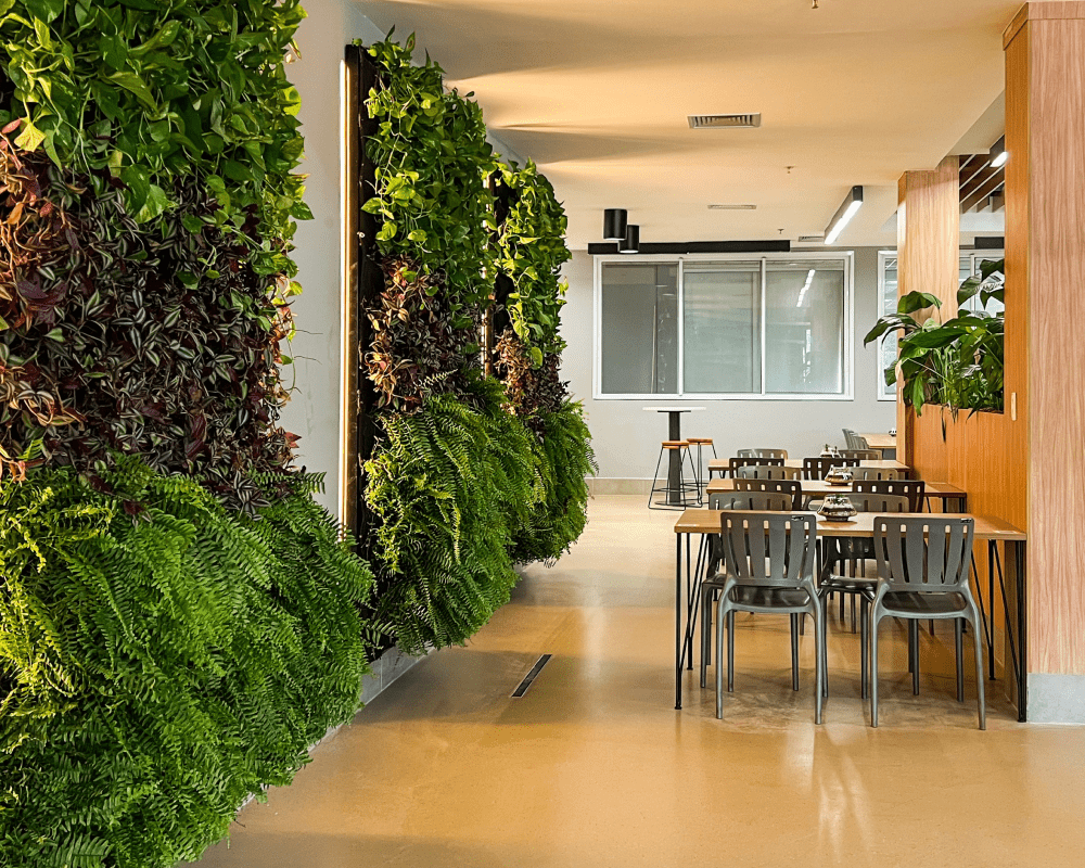 Room with greenery on the walls, providing a refreshing and lively environment.