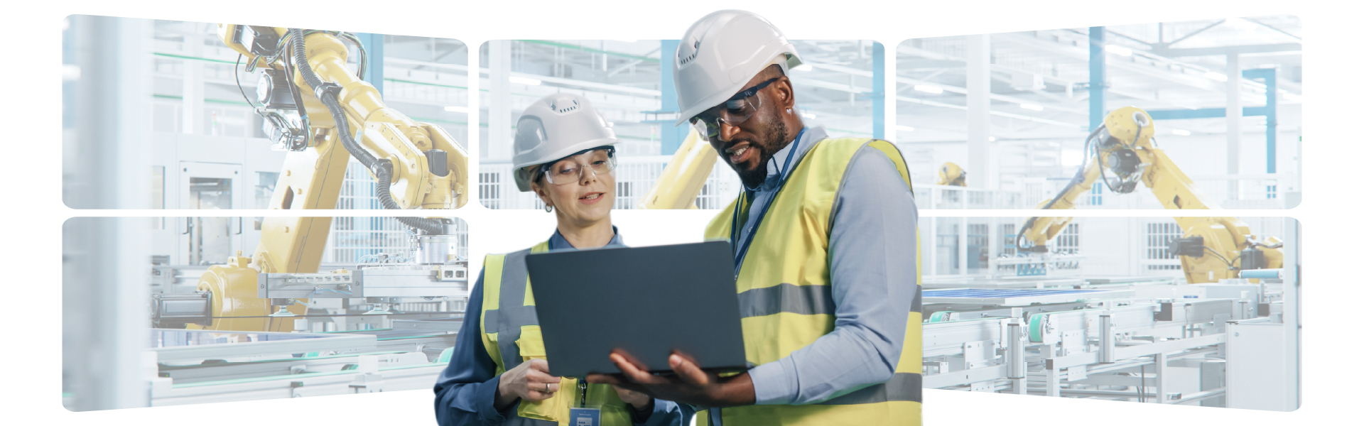 Two individuals wearing hard hats and safety glasses are focused on a laptop screen, engaged in a work-related task.