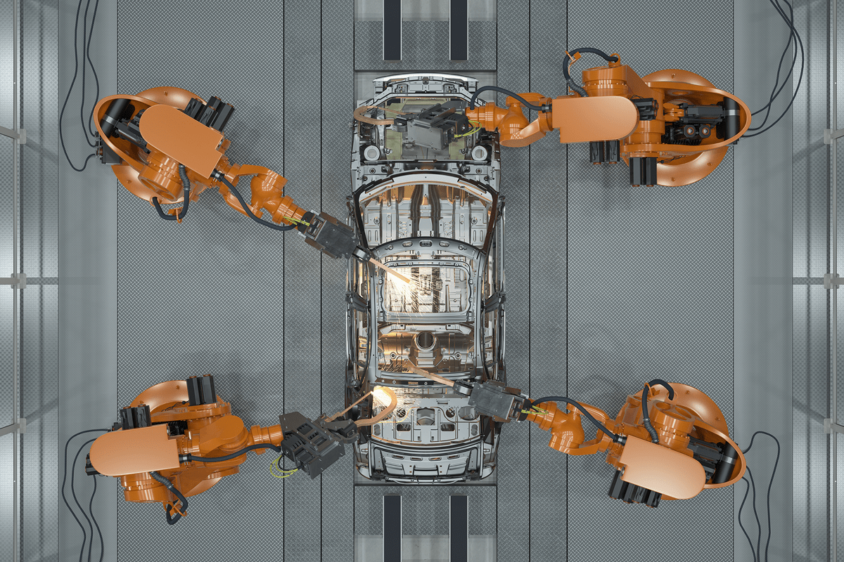 Robots assembling a car on a factory production line, showcasing advanced automation in automotive manufacturing.