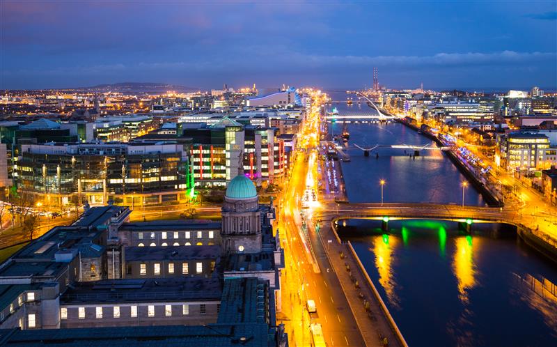 Night view of Dublin, showcasing the River Liffey and the city’s vibrant lights and architecture along the waterfront.