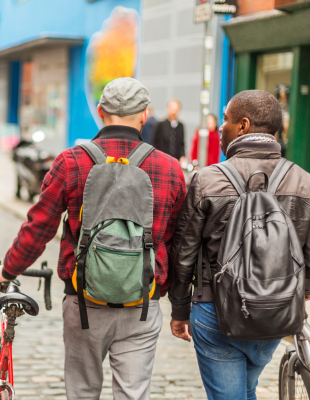 Men with bicycles in the city in the Temple Bar district of Dublin, Ireland
