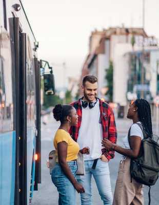 Group of young people waiting in front of a hydrogen fuel cell bus