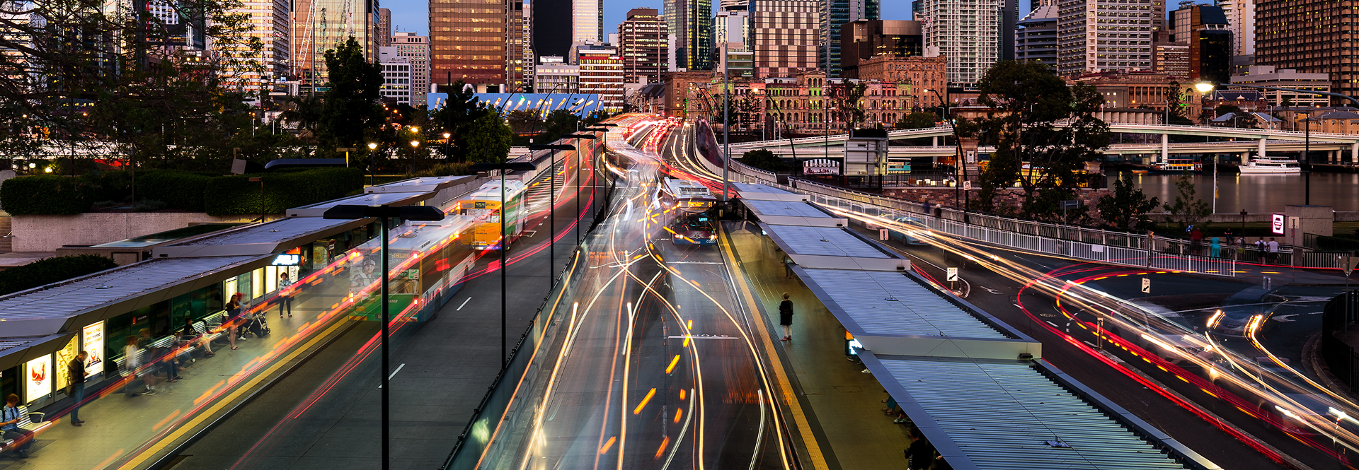 A busy city street filled with various vehicles and heavy traffic during the day.