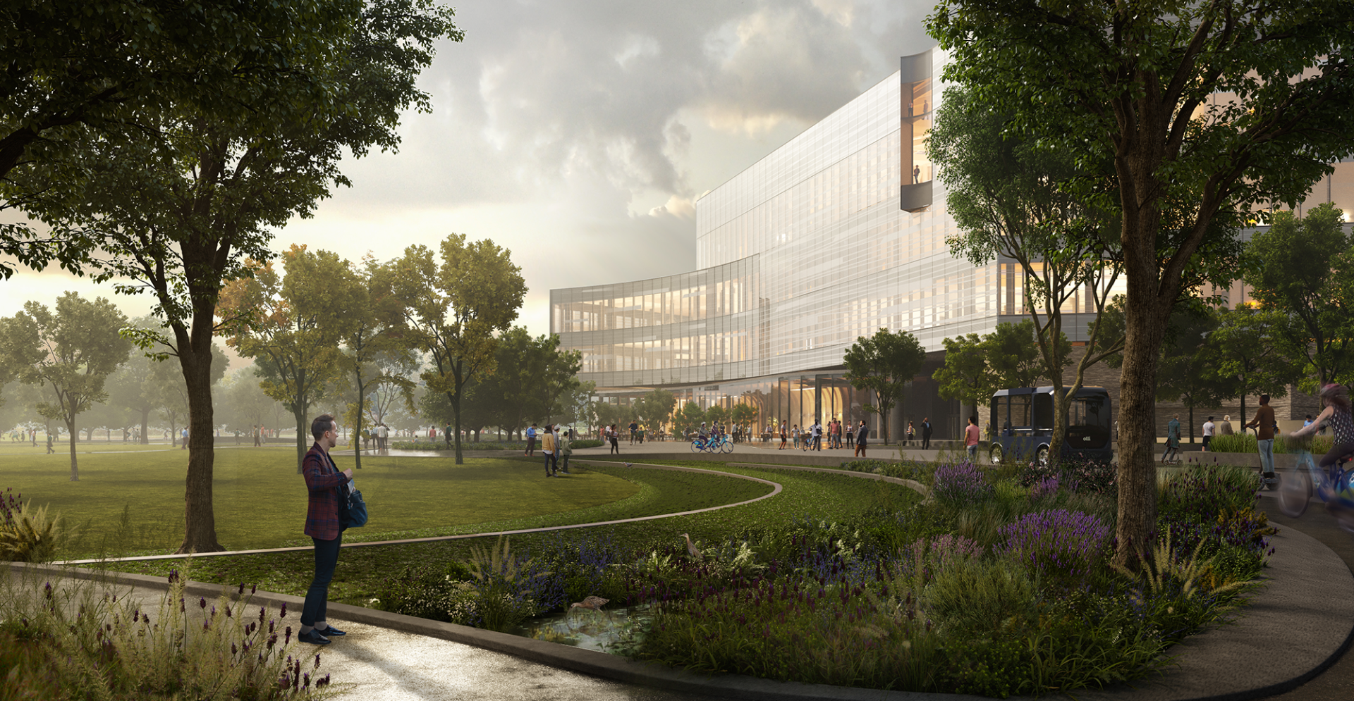 A landscape view of a man gazing at the Ford Research and Engineering Centre.