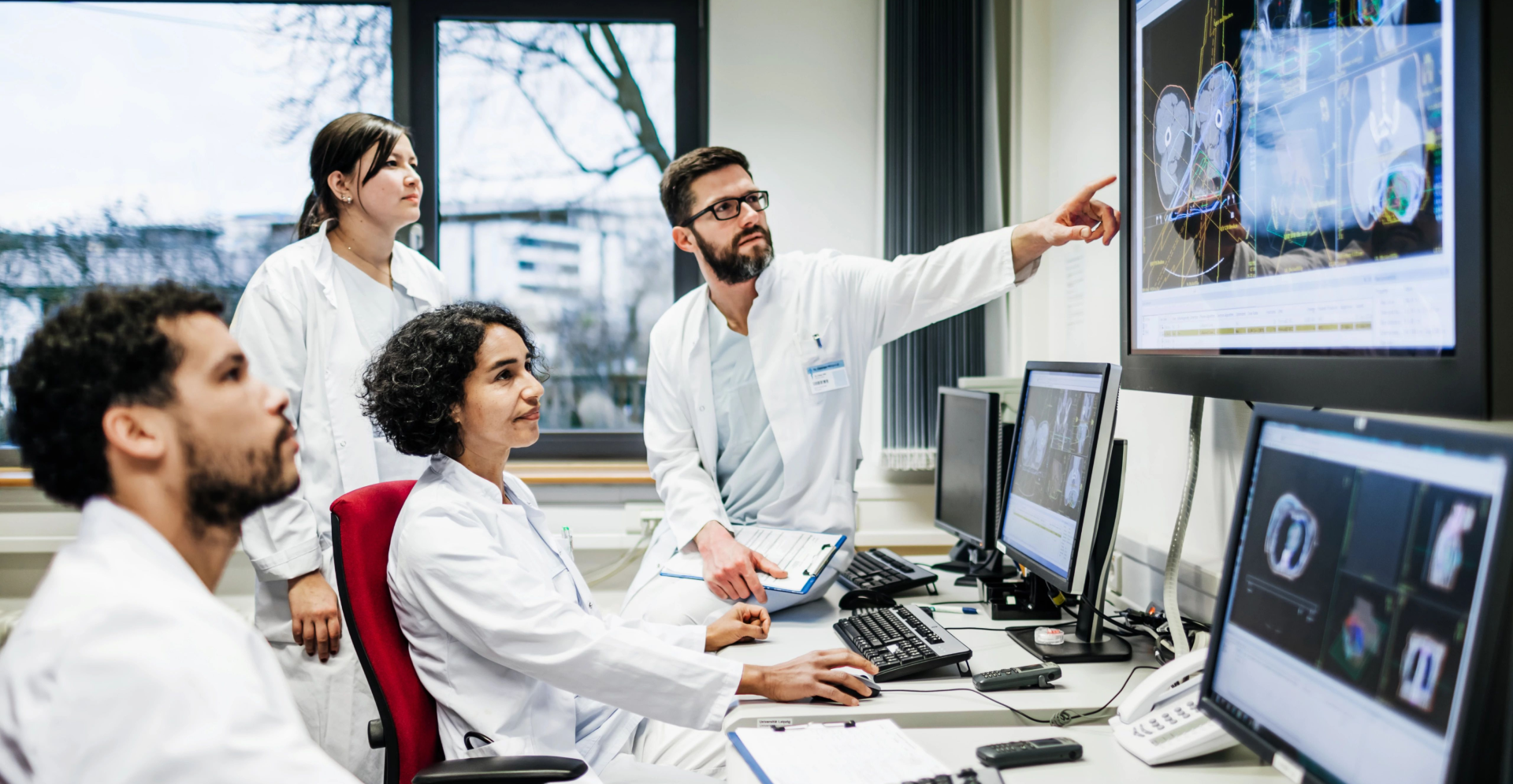 Group of medical professionals looking at an x-ray