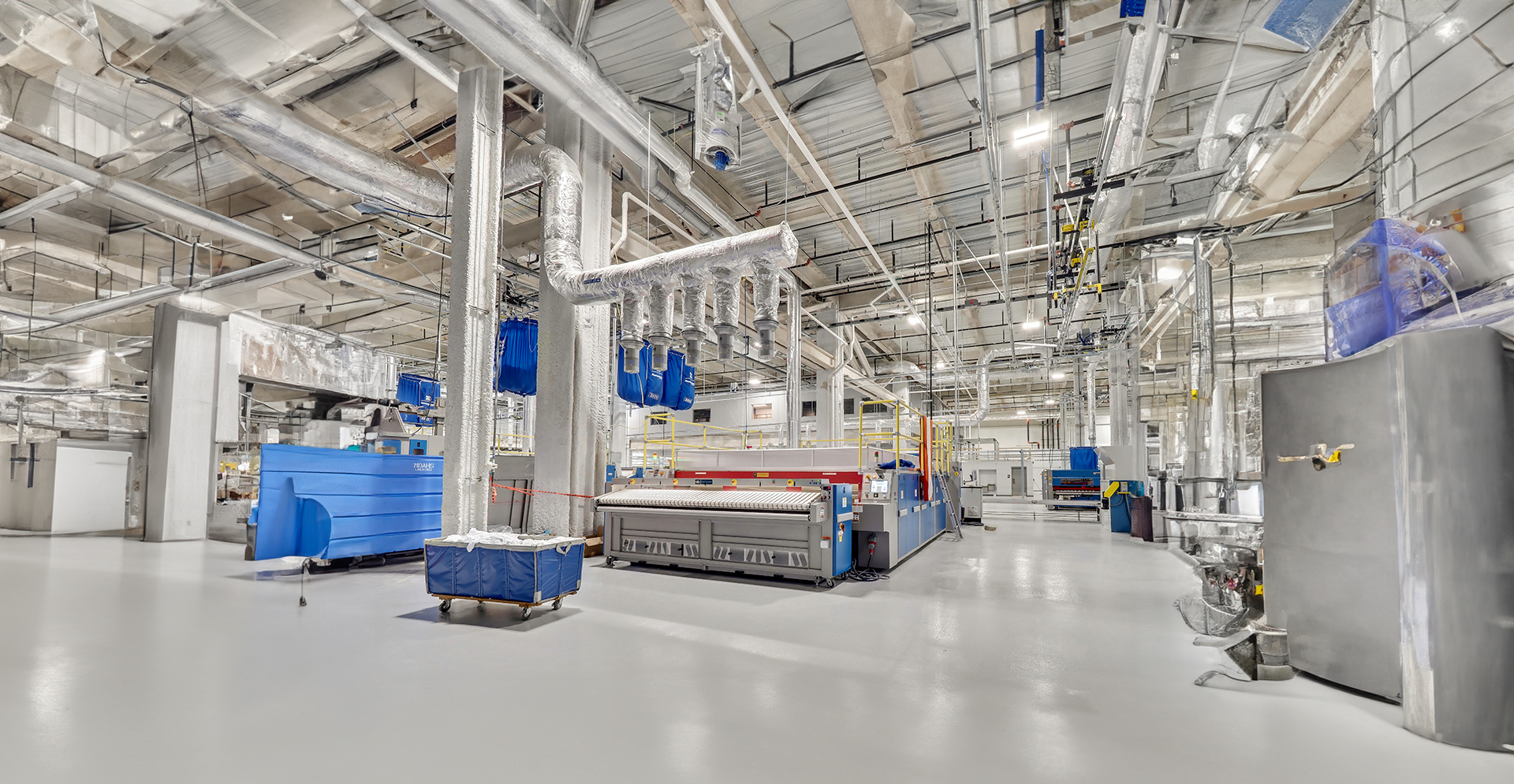 An industrial factory scene featuring numerous machines and equipment, highlighting the essence of manufacturing.